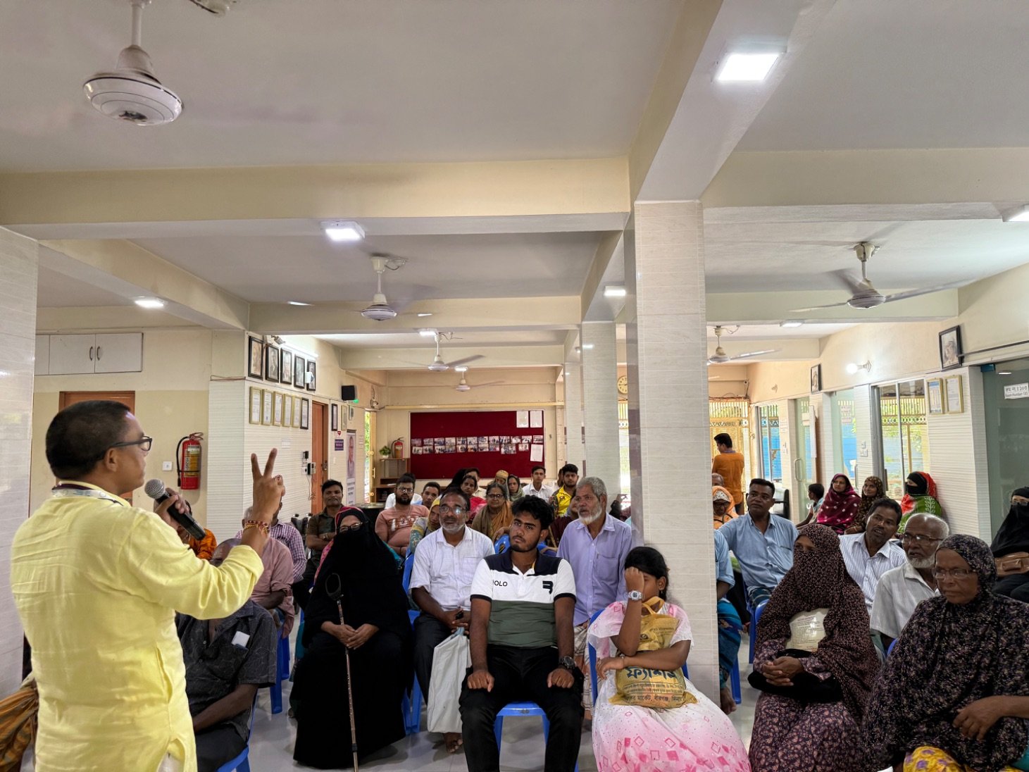 Addressing a community gathering